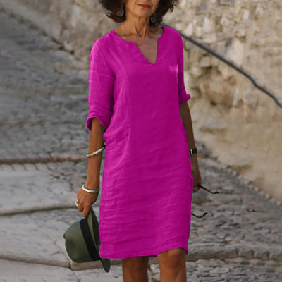 Robe élégante longueur genou au style intemporel avec manches trois quarts