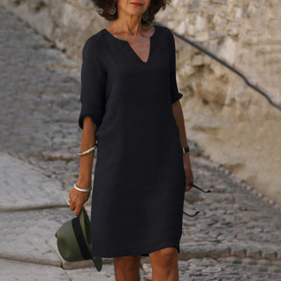 Robe élégante longueur genou au style intemporel avec manches trois quarts