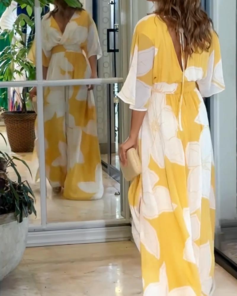 Robe longue fleurie avec manches chauve-souris