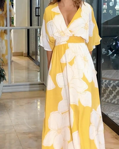 Robe longue fleurie avec manches chauve-souris